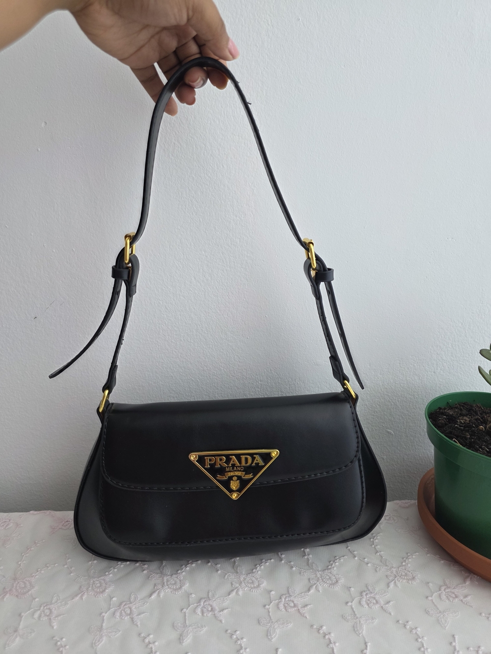 Prada Black Leather Shoulder Bag with Gold Logo Plaque